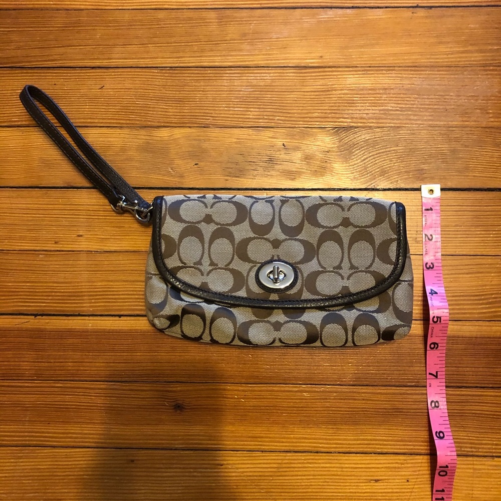 Coach wristlet, flip with turn lock